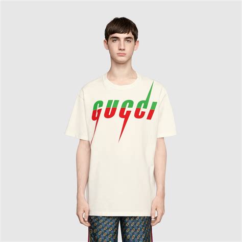 GUCCI Maglia bianca con stampe logo .